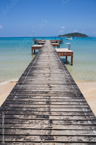 Wooden jetty on exotic beach Koh Chang island  Thailand