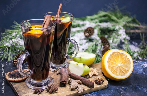 Two glasses of fragrant mulled wine on the Christmas background. Traditional Christmas drink.