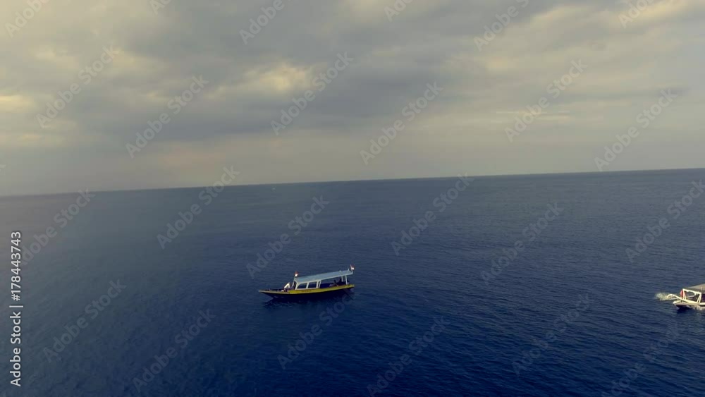 aerial approaching little fishing boat aerial approaching little fishing boat