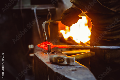 blacksmith working on an anvil