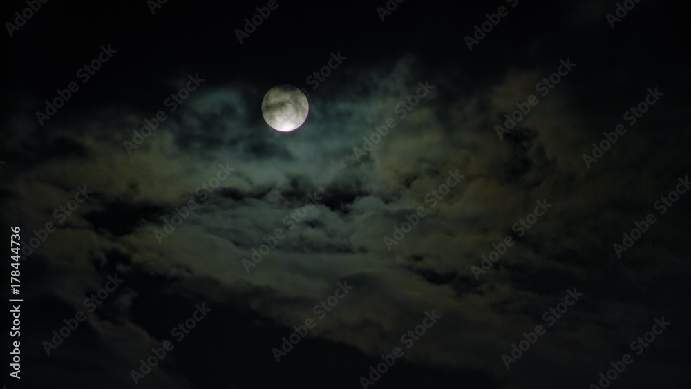 Naklejka premium New Moon and Clouds in the Pitchblack Sky