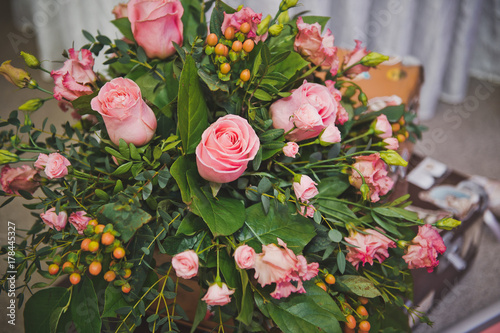 A huge bouquet of roses and various greenery. 8579