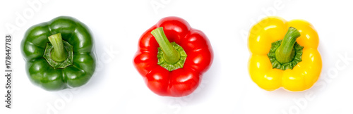 Fotografia top view of three colors sweet bell pepper on white background ( Capsicum annuum