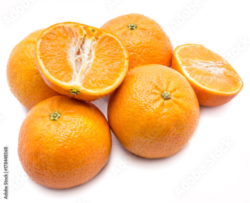 Composition of four whole Clementines and two halves isolated on white background