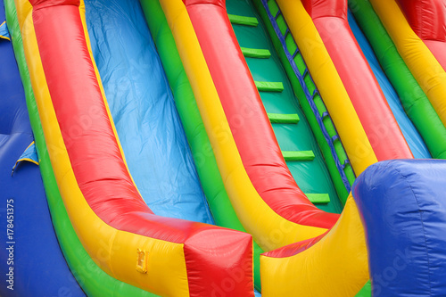a colourful inflatable slide at a carnival