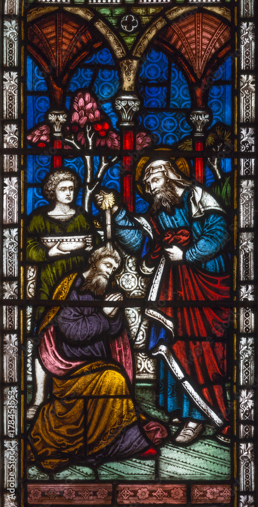 LONDON, GREAT BRITAIN - SEPTEMBER 19, 2017: The baptism of St. Paul by Ananias on Stained glass in St Mary Abbot's church on Kensington High Street.