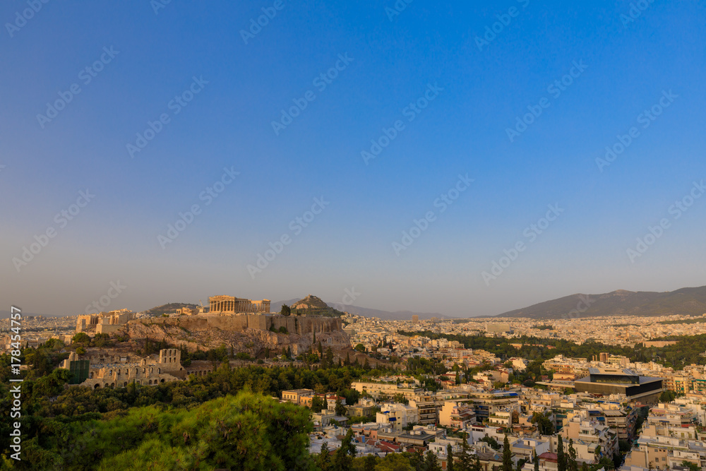 View to Parthenon, Akropolis from Filopappou Hill or Hill of the Muses at sunset on sunny summer day View to Parthenon, Akropolis from Filopappou Hill or Hill of the Muses at sunset on sunny summer day