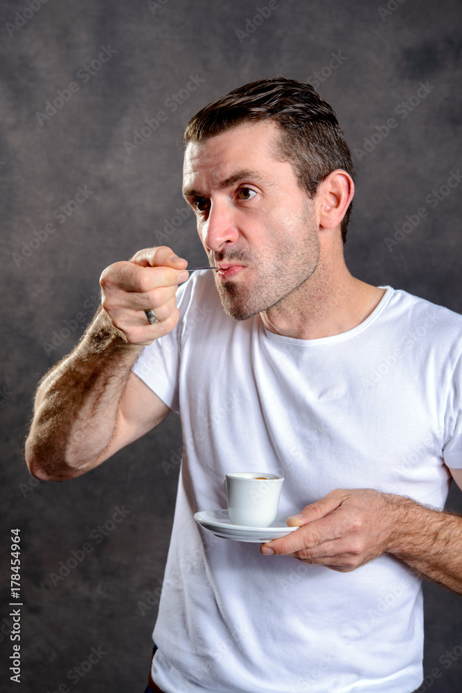 Fototapeta premium dark haired man drinking espresso
