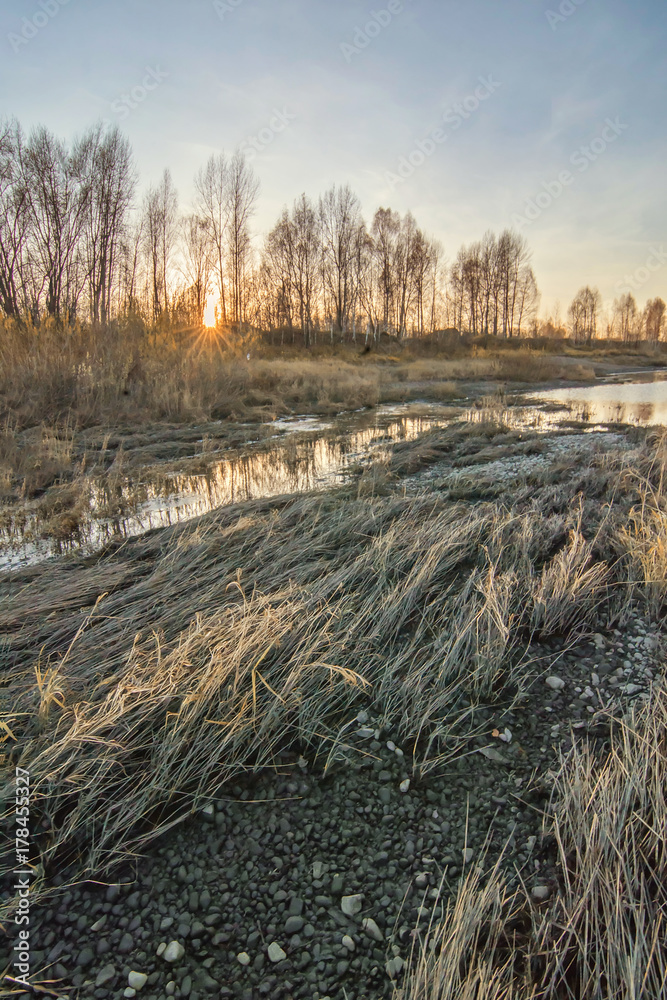 Autumn sunset with river. Vertical background