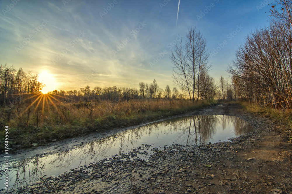 Autumn rural landscape with country road in Siberia Russia. Horizontal background