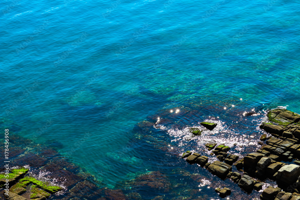 Mediterranean sea, Greece, clean blue water lagoon. Beautiful sea shore, rocks, natural backdrop.