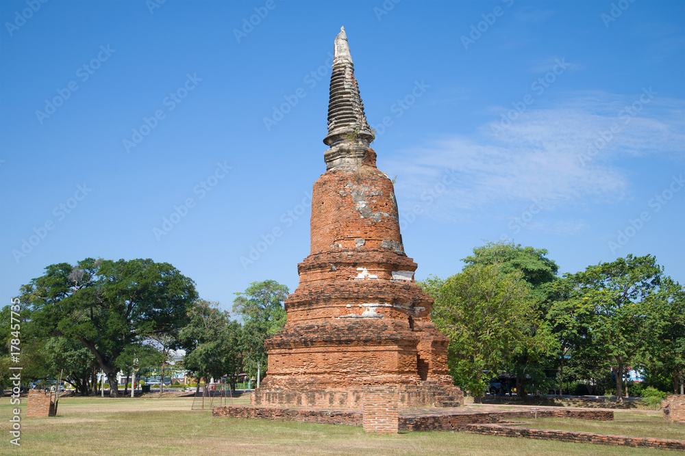 An ancient stupa of the Buddhist temple Wat Langkhakhao on a sunny afternoon. Ayutthaya, Thailand