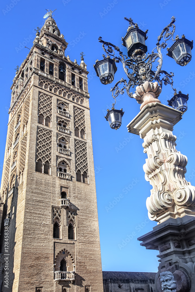 Bell tower of Seville Cathedral  and Monumental fountain , Seville.