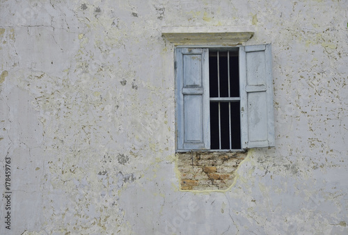 old wall with peeling paint, and window