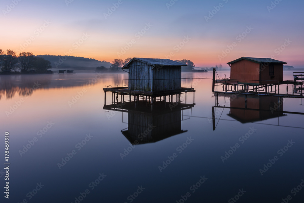 French countryside - Lorraine. A small lake with fisherman's hut at sunrise.