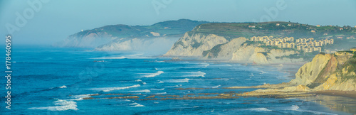 Sea mist over the coast cliffs in Sopelana photo