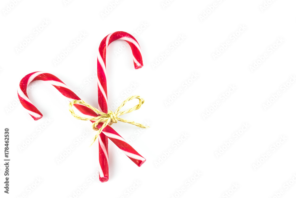 Red white striped candy canes, white background