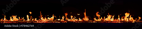 Horizontal fire flames with dark background