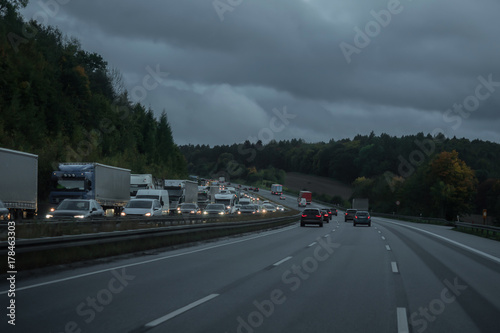 The highway during a car drive with a view of a traffic jam