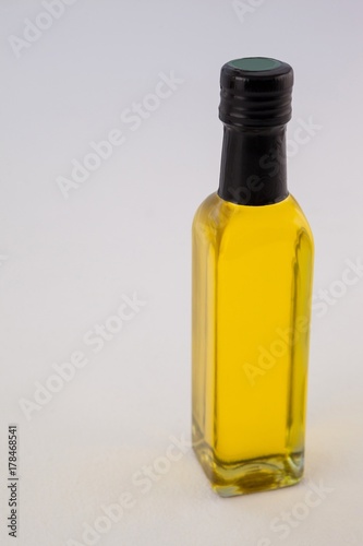 High angle view yellow oil bottle against wall