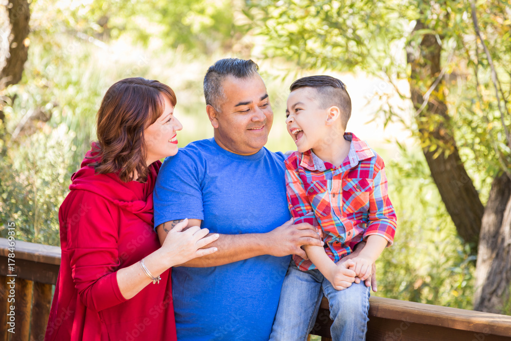 Mixed Race Caucasian and Hispanic Family At The Park.