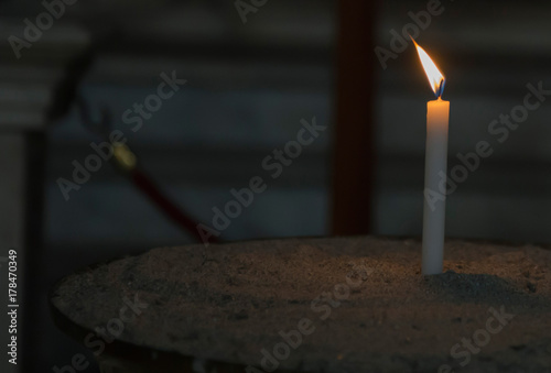 candle lit in brazier photo