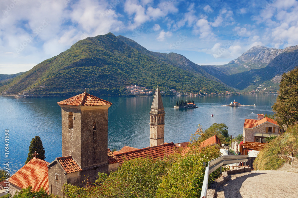 View of Perast town on the Bay of Kotor and islands of St. George and Our Lady of the Rocks. Montenegro, autumn