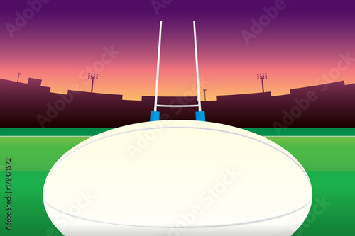 Rugby ball isolated on green field and stadium on purple sky background.