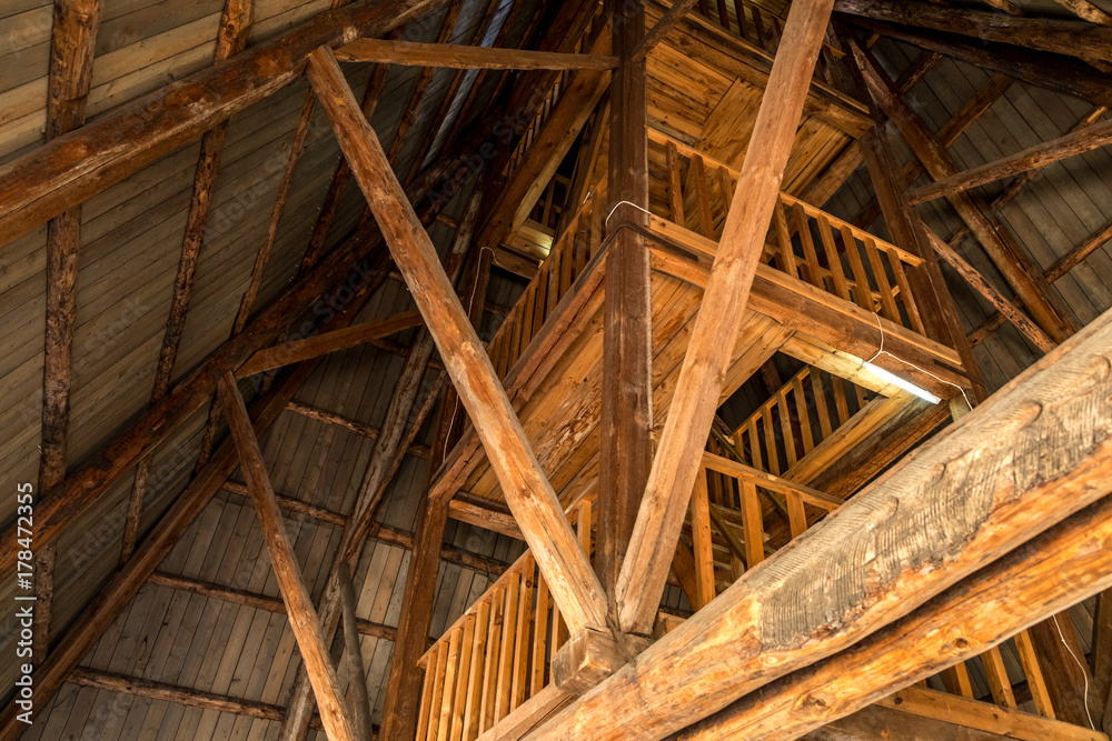 Naklejka premium Old wooden staircase in a wooden tower