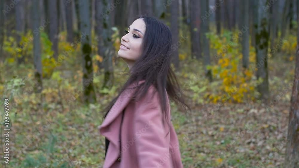 Woman Walking in the autumn park Woman Walking in the autumn park