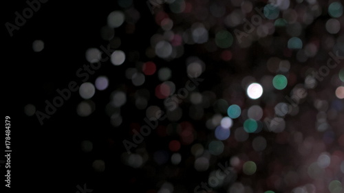 Realistic Glitter Exploding on Black Background.