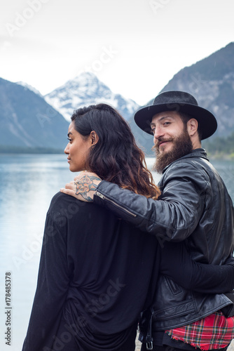 Hipster couple enjoys nature and scenic mountain lake in Austria © benicoma