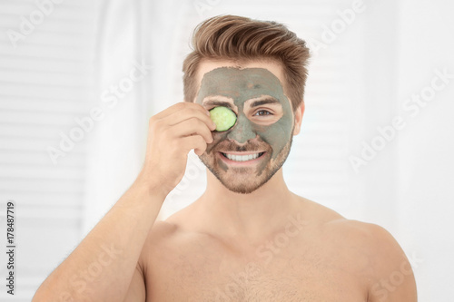 Young man with cosmetic mas...