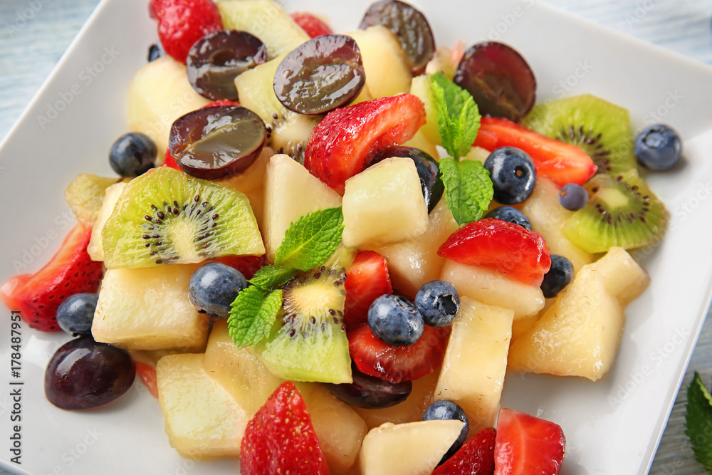 Plate with delicious fruit salad, closeup Plate with delicious fruit salad, closeup