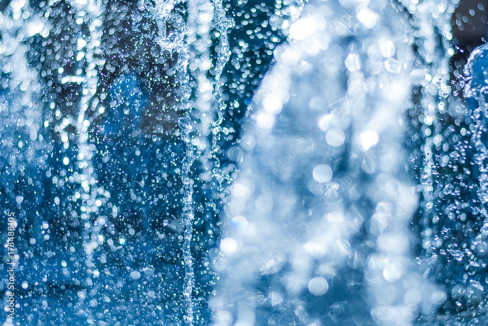 The gush of water of a fountain. Splash of water in the fountain, abstract image