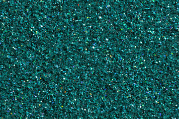 Dark turquoise shining background with glitter.