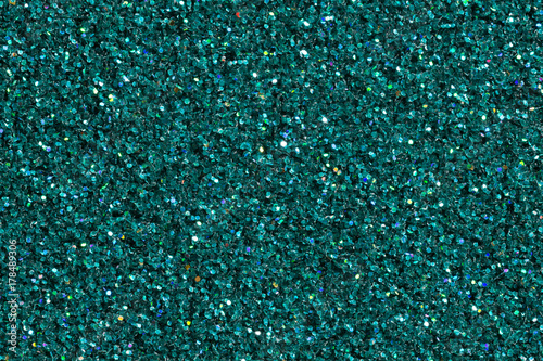 Dark turquoise shining background with glitter. photo