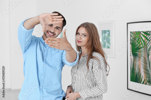 Young couple in art gallery