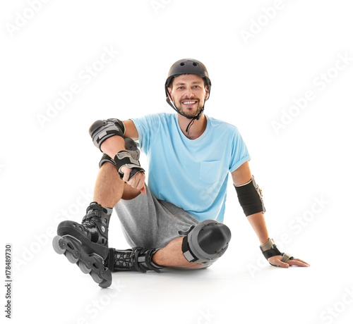 Handsome man with roller sk...