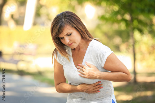 Obraz na plátně Mature woman having heartache outdoors