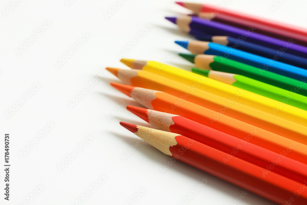 Colorful pencils on white background