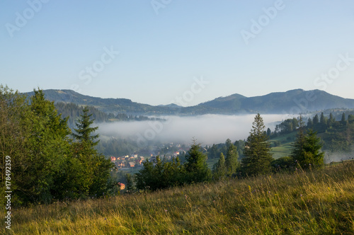 Cloud over the village in the mountains