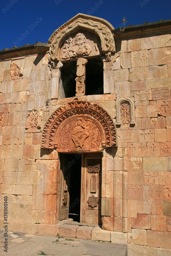 Φωτογραφία The facade of Surb Karapet Church with a striking depiction of God the Father (upper relief)