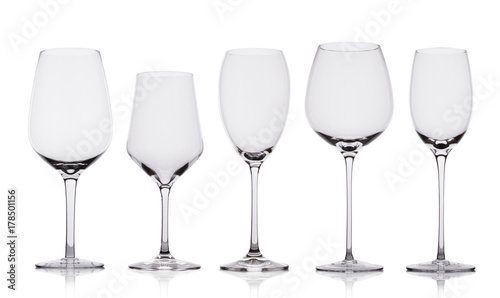 Empty wine glasses with reflection on white