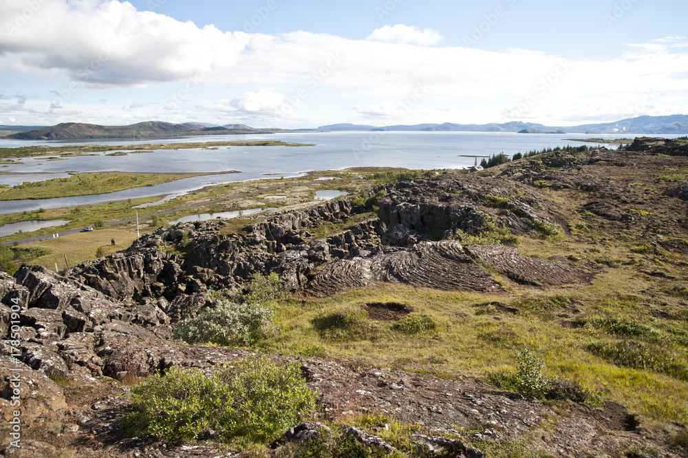 National Park Thingvellir - Almannagjà canyon, Typical Icelandic landscape, a wild nature of rocks and shrubs, rivers and lakes.