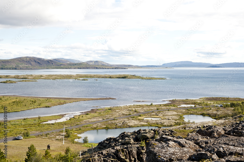 National Park Thingvellir - Almannagjà canyon, Typical Icelandic landscape, a wild nature of rocks and shrubs, rivers and lakes.