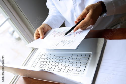 doctor working on a computer at his cabinet