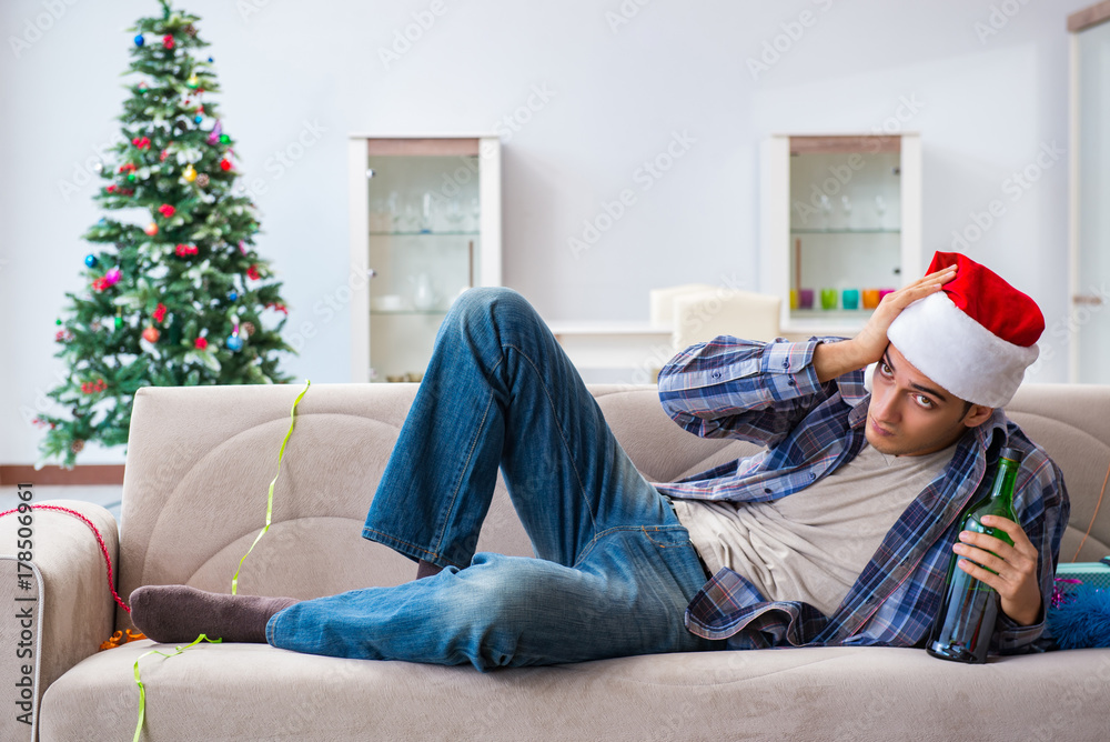 Obraz premium Man having hangover after christmas party