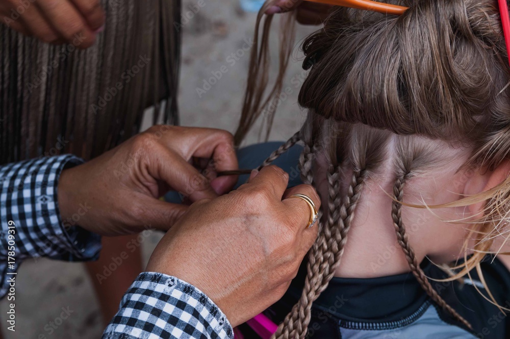 Fototapeta premium girl braids on the beach