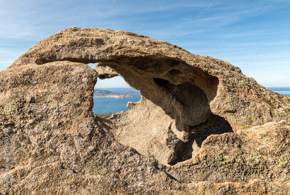 Calvi in Corsica viewed through a hole in a rock